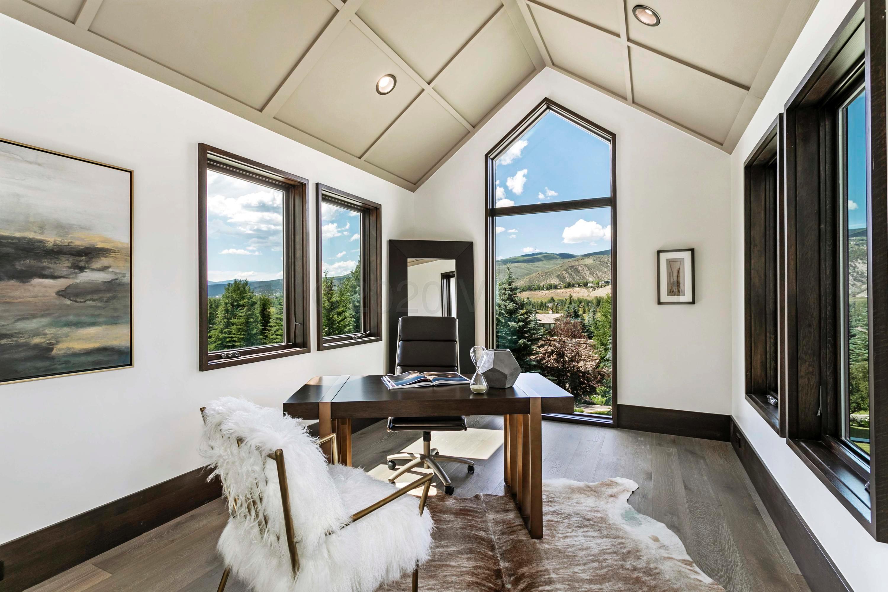 144 Castle Peak Gate Edwards, CO 81632 - Photo 22 of 46 a living room with furniture and a large window