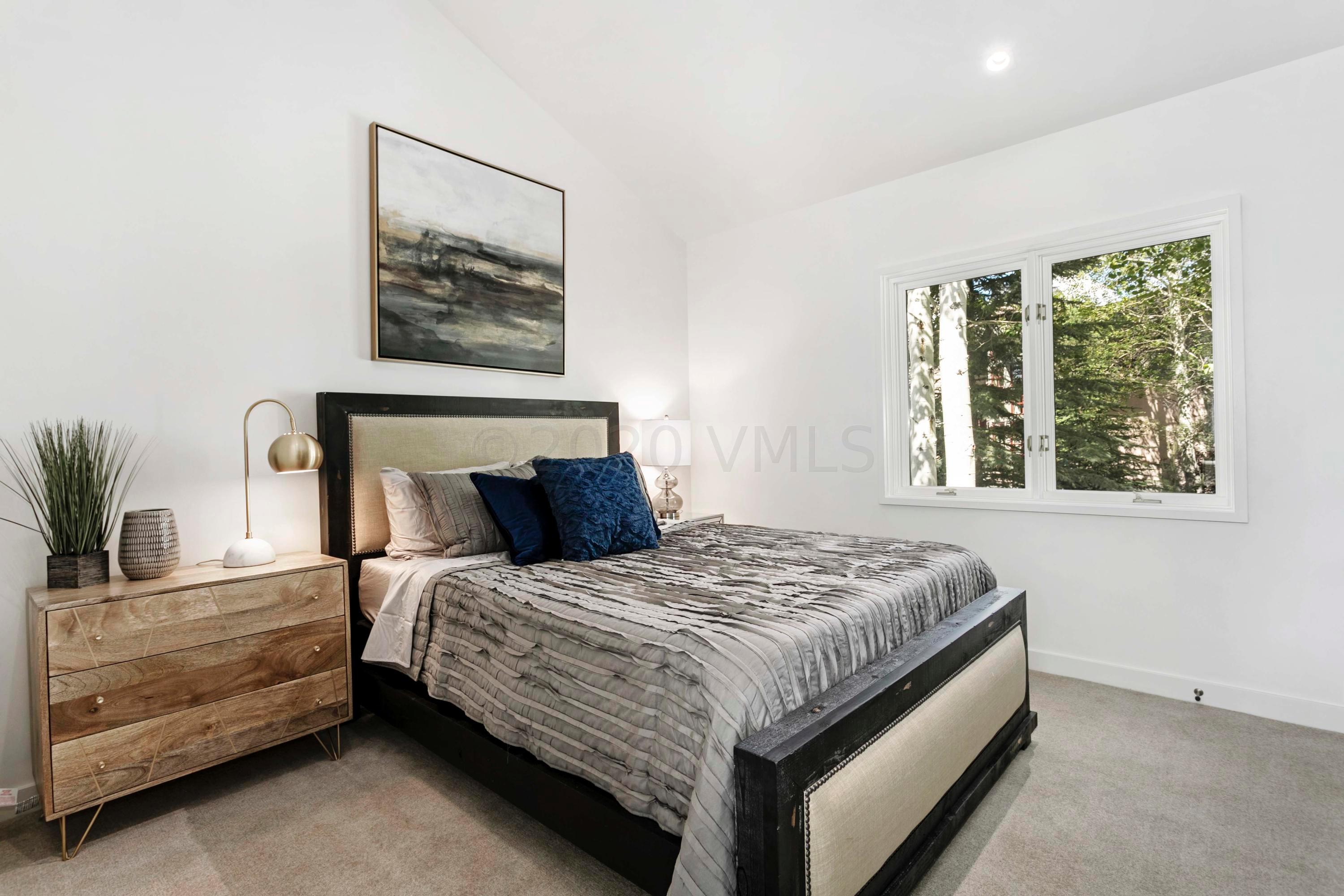 144 Castle Peak Gate Edwards, CO 81632 - Photo 25 of 46 a bedroom with a bed and a painting on the wall