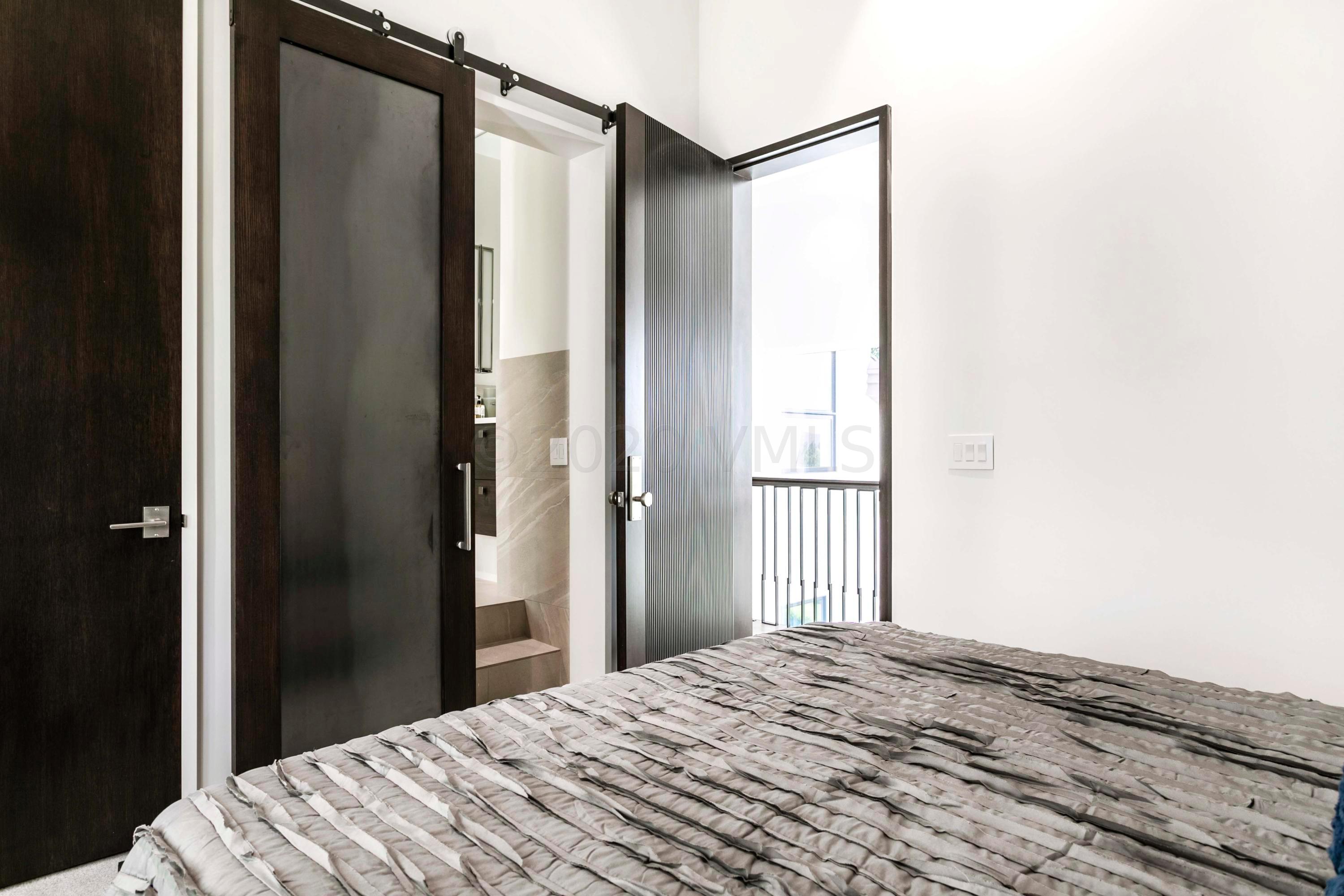 144 Castle Peak Gate Edwards, CO 81632 - Photo 26 of 46 a bedroom with a bed and a window