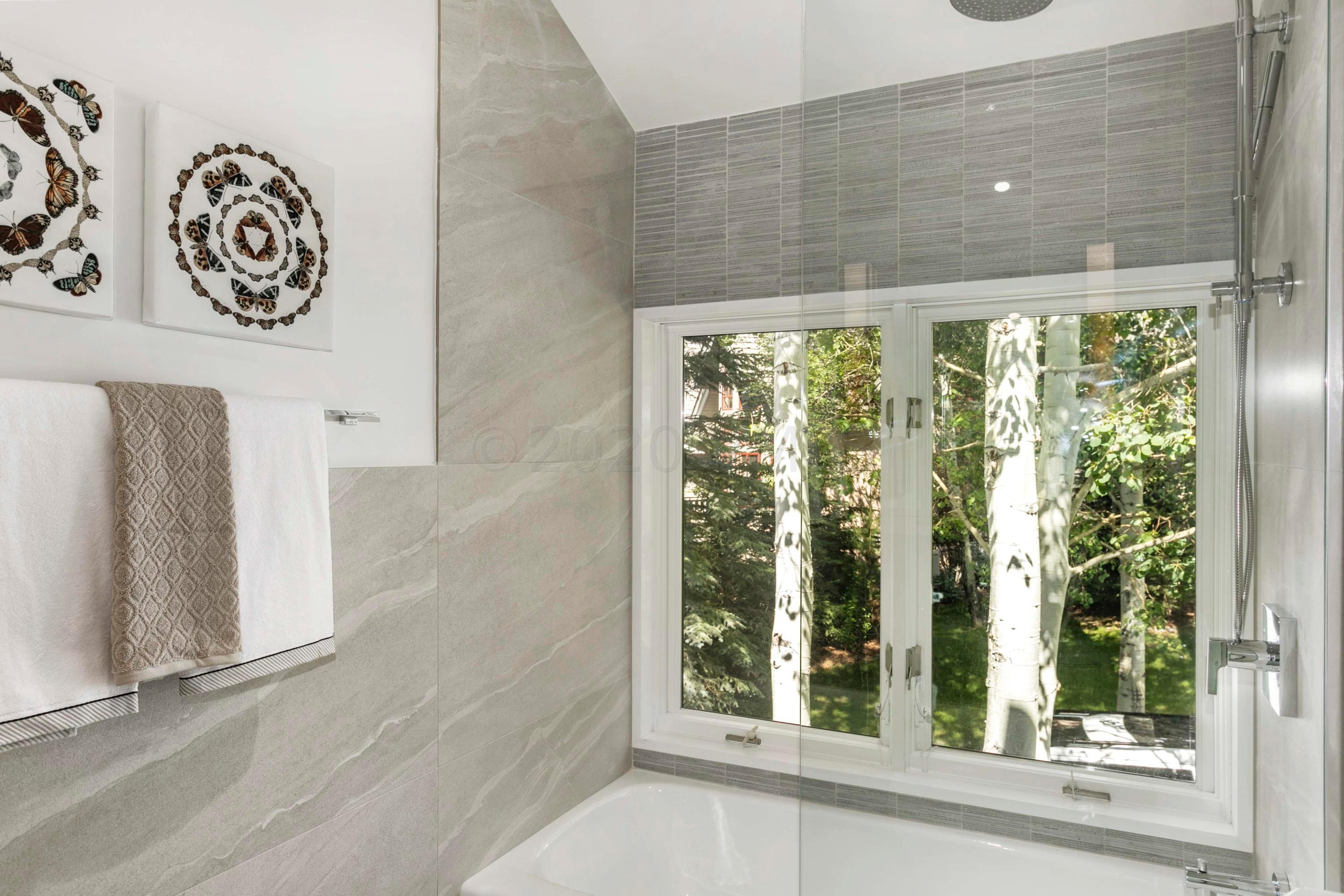 144 Castle Peak Gate Edwards, CO 81632 - Photo 28 of 46 a bathroom with a window and a shower