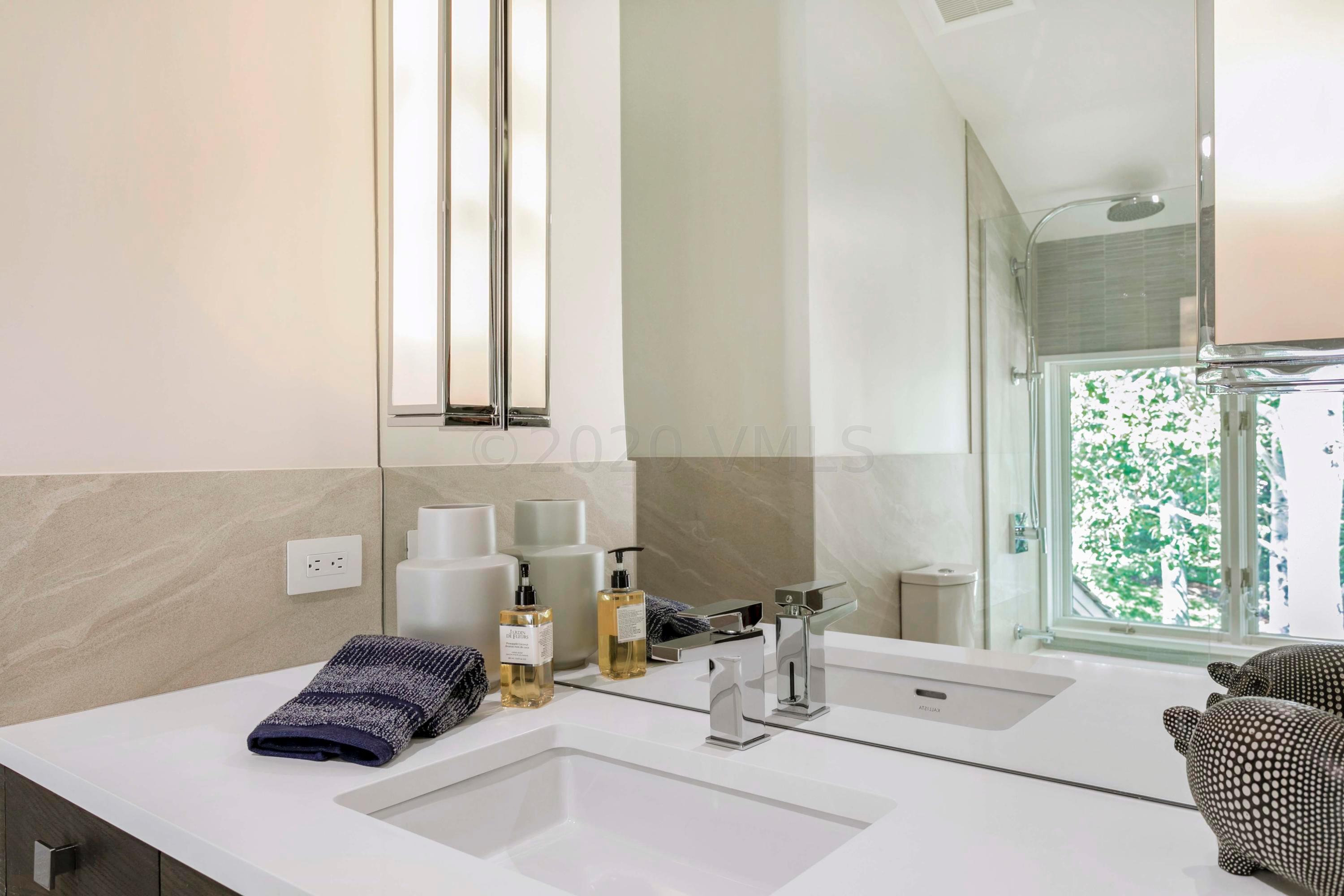 144 Castle Peak Gate Edwards, CO 81632 - Photo 29 of 46 a bathroom with a sink and a mirror