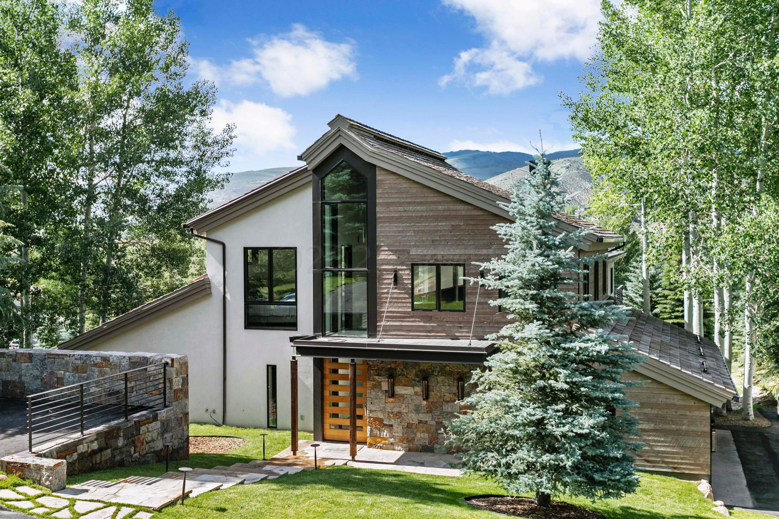 144 Castle Peak Gate Edwards, CO 81632 - Photo 3 of 46 a front view of a house with garden