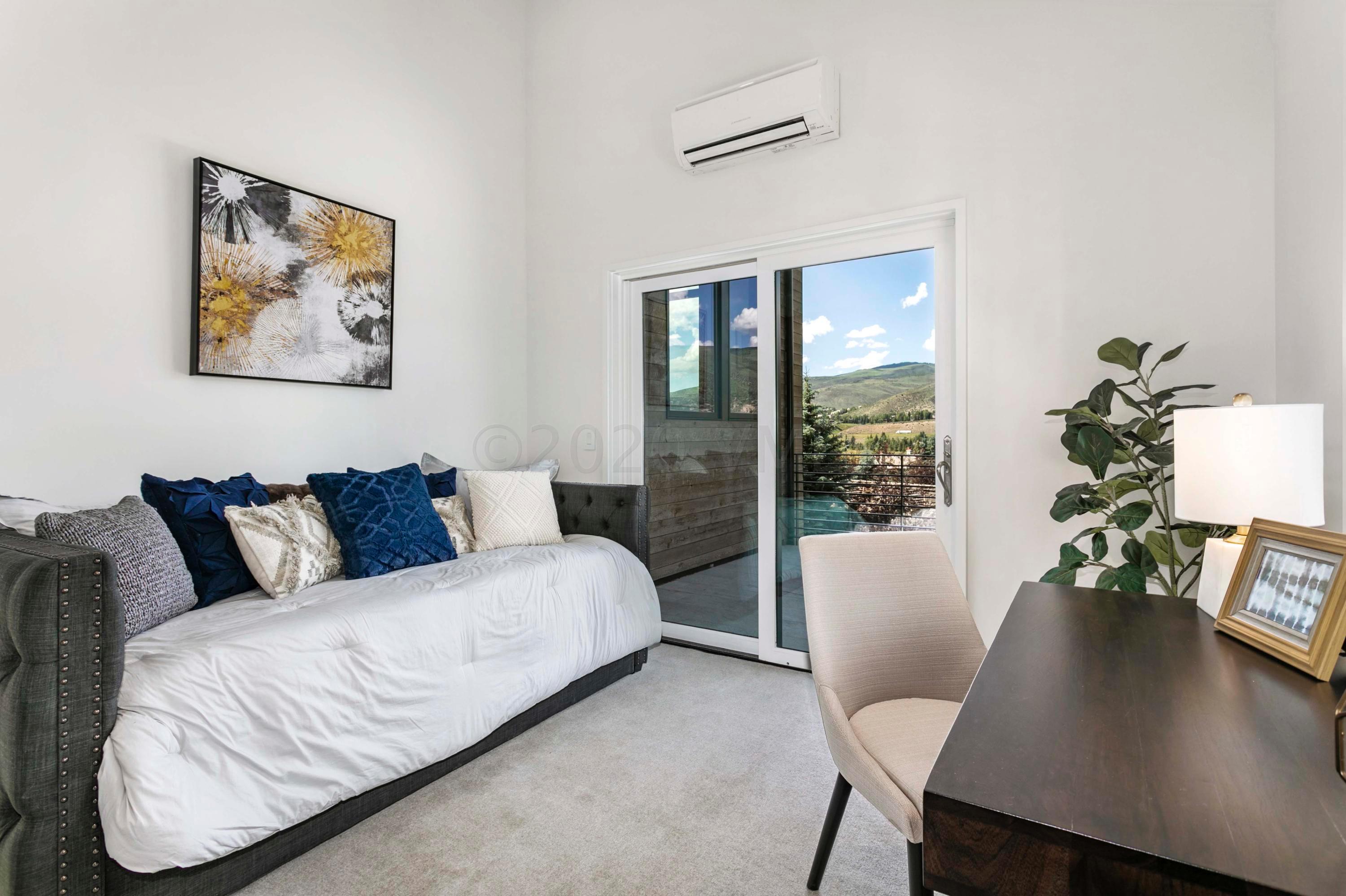 144 Castle Peak Gate Edwards, CO 81632 - Photo 31 of 46 a living room with furniture and a large window