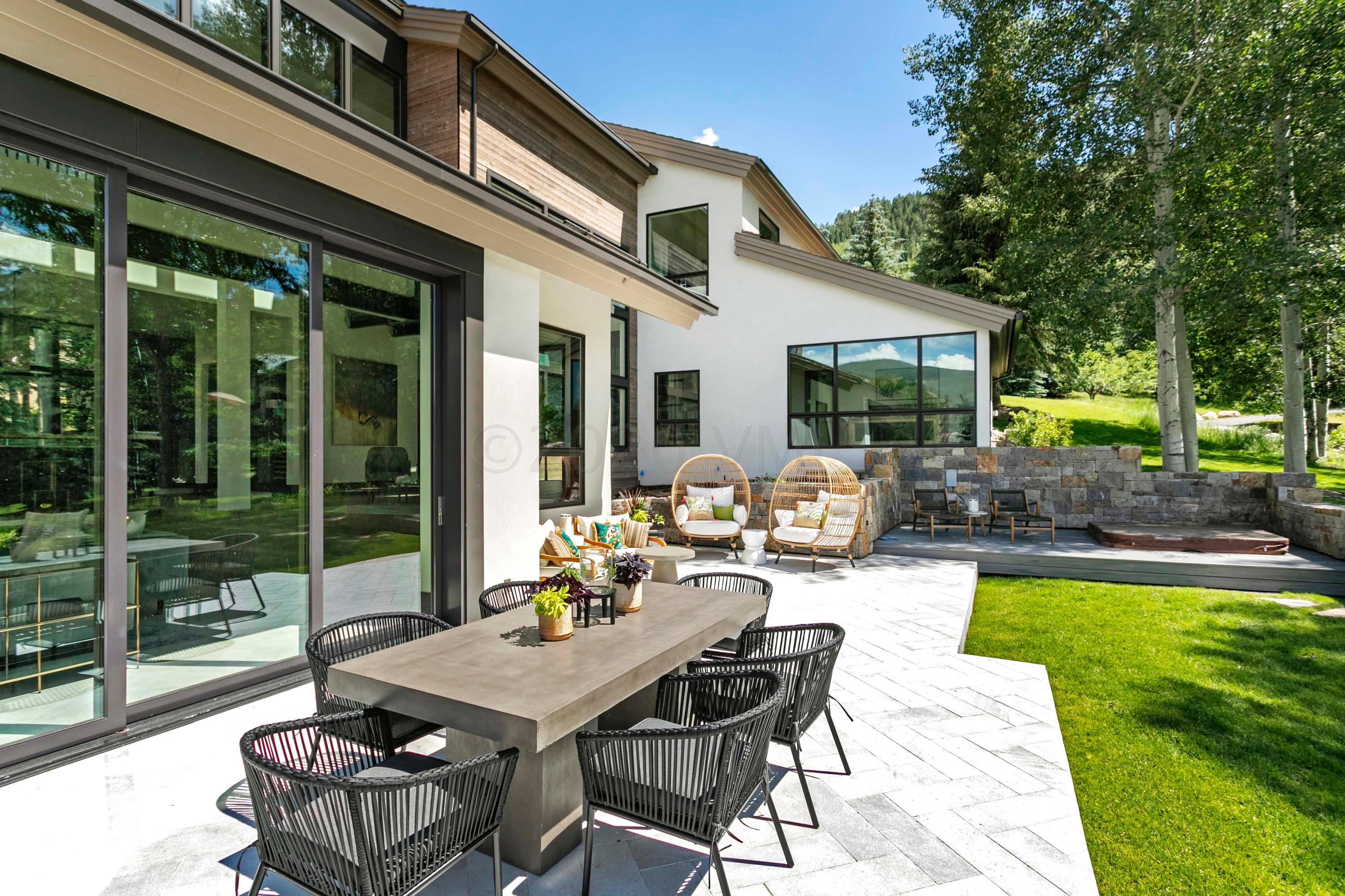144 Castle Peak Gate Edwards, CO 81632 - Photo 35 of 46 a view of a patio with couches table and chairs and potted plants