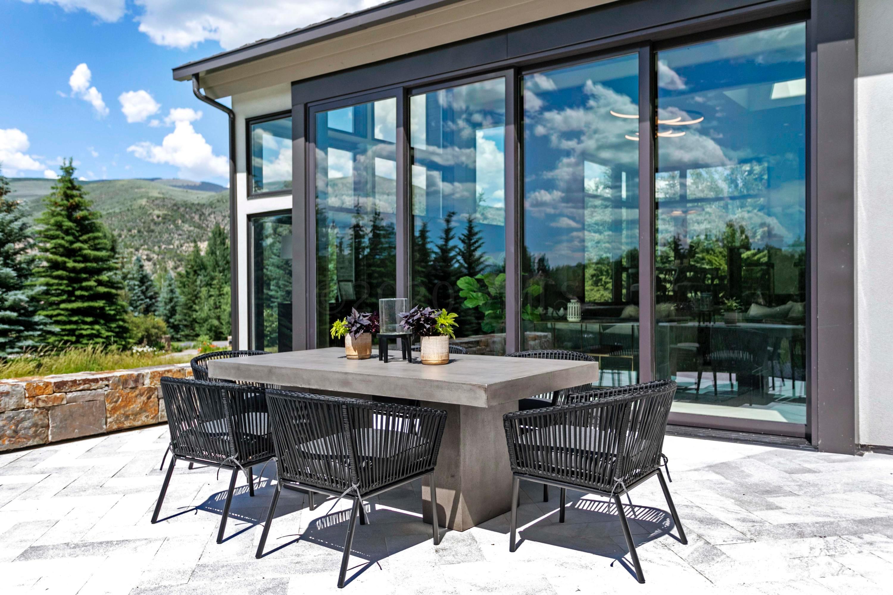 144 Castle Peak Gate Edwards, CO 81632 - Photo 38 of 46 a view of a patio with a table chairs and backyard