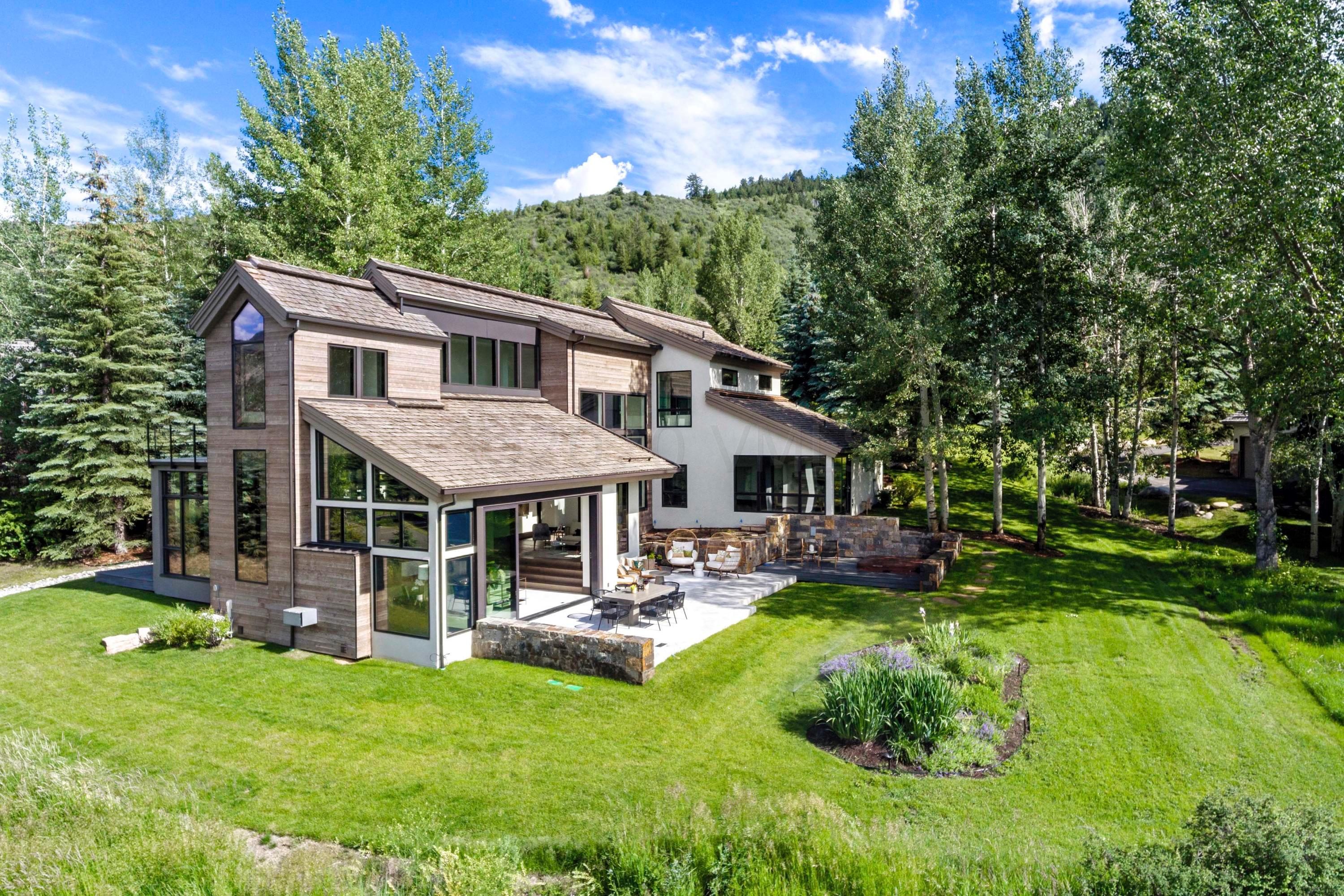 144 Castle Peak Gate Edwards, CO 81632 - Photo 41 of 46 a backyard of a house with yard table and chairs