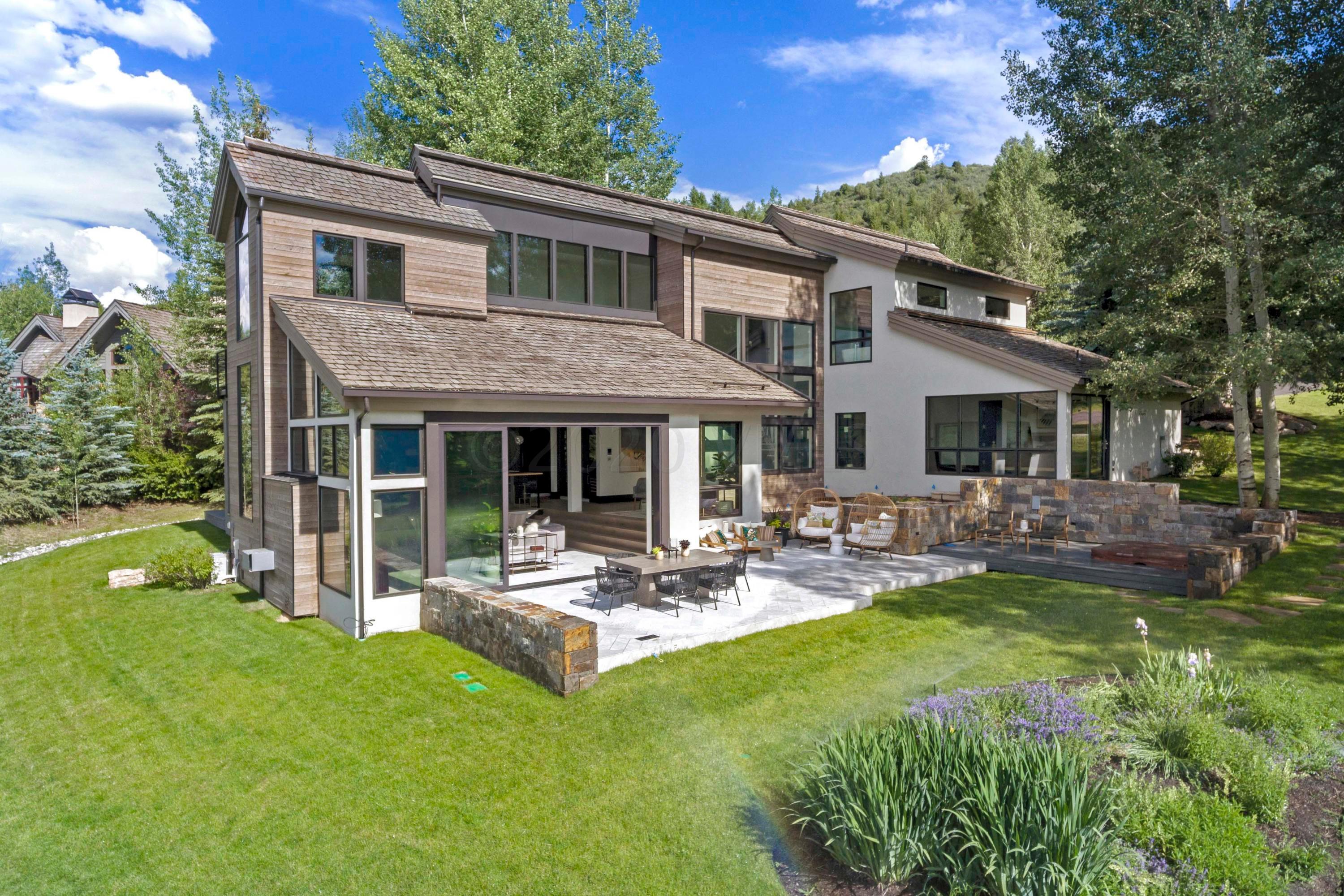 144 Castle Peak Gate Edwards, CO 81632 - Photo 42 of 46 a view of a house with a yard and sitting area