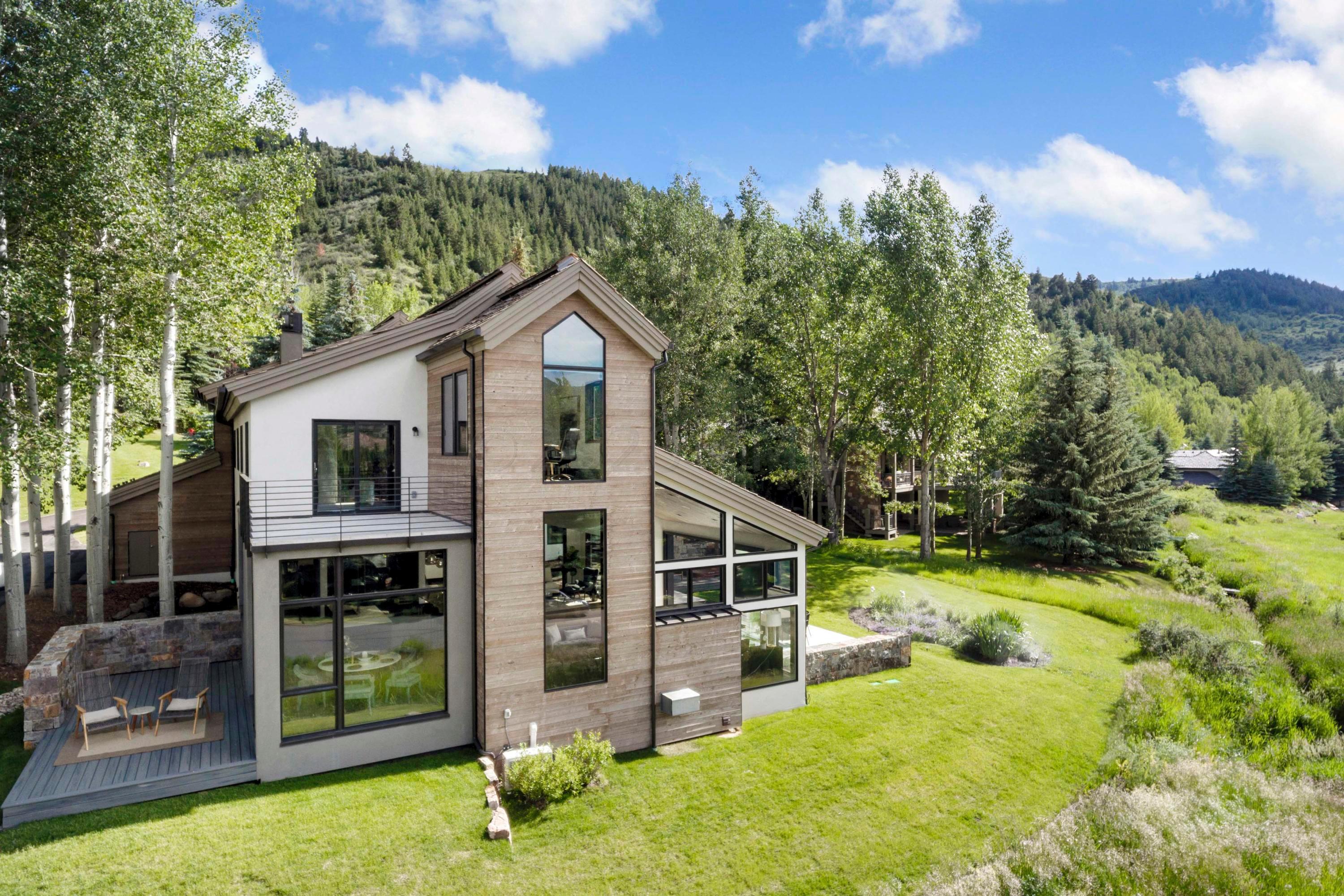 144 Castle Peak Gate Edwards, CO 81632 - Photo 45 of 46 a view of a house with backyard porch and garden