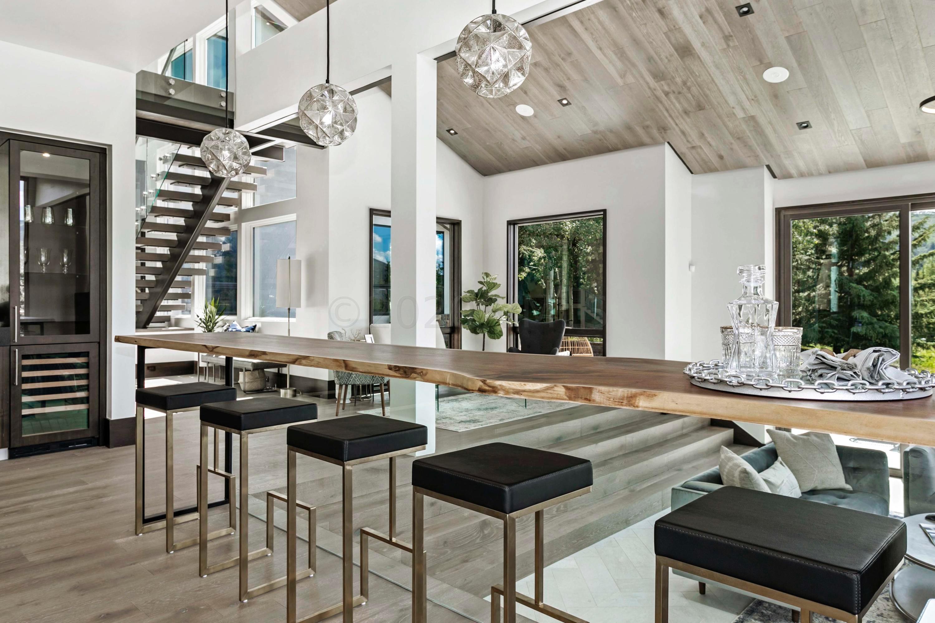 144 Castle Peak Gate Edwards, CO 81632 - Photo 7 of 46 a view of a dining room with furniture window and wooden floor