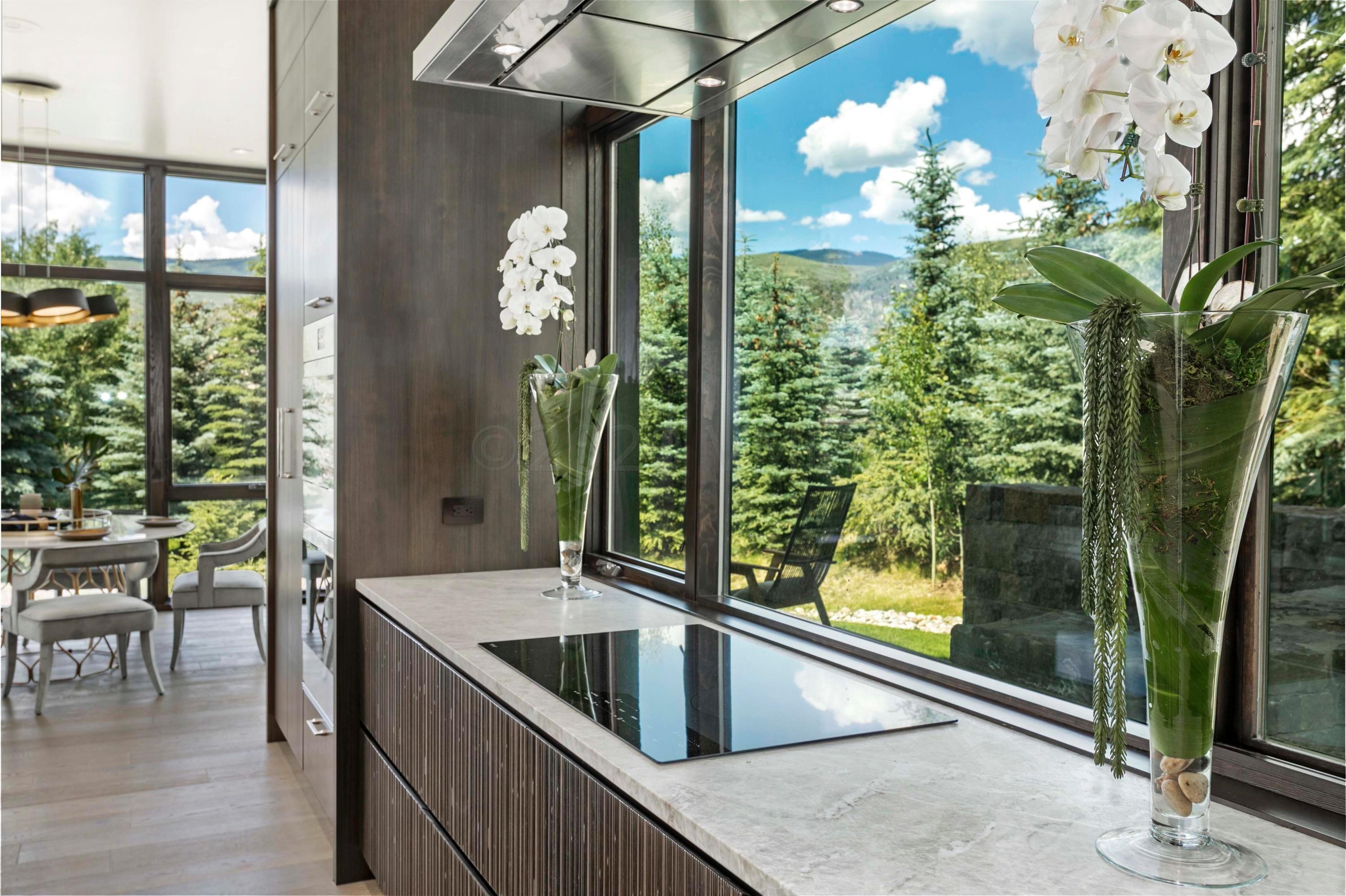 144 Castle Peak Gate Edwards, CO 81632 - Photo 8 of 46 a kitchen with a sink and large windows