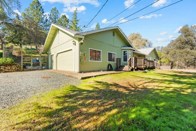 a swimming pool with yard and outdoor seating