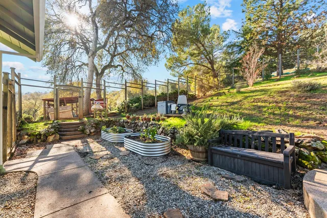 a view of a patio with couches and potted plants