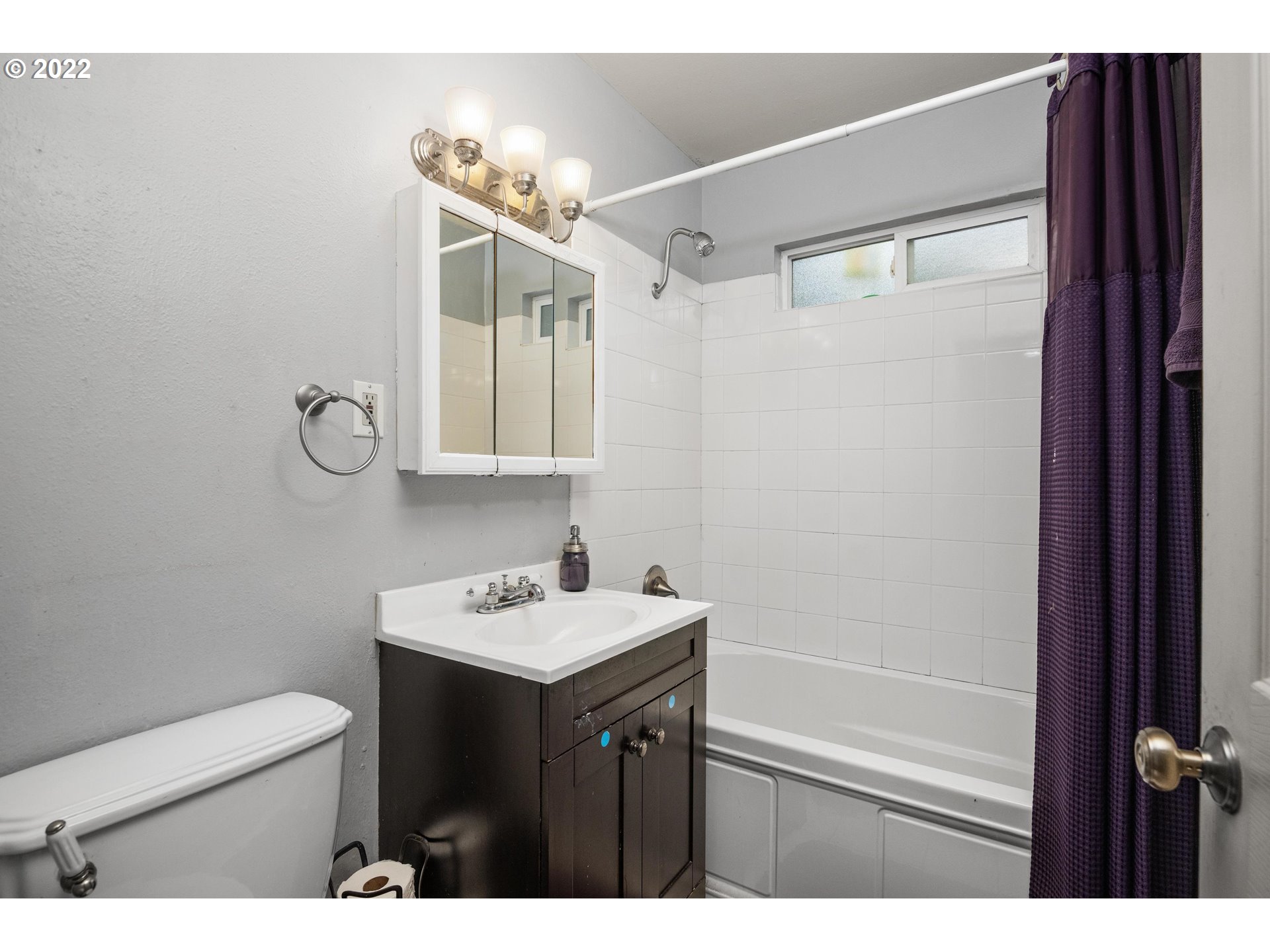 12855 Southwest Douglas Street Portland, OR 97225 - Photo 17 of 32 a bathroom with a sink a toilet a mirror and shower