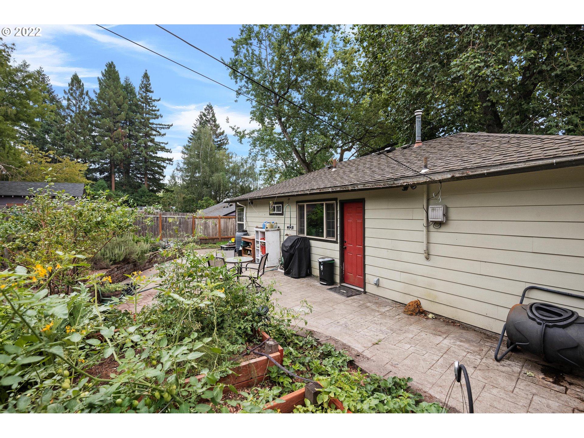 12855 Southwest Douglas Street Portland, OR 97225 - Photo 19 of 32 a view of a house with a patio
