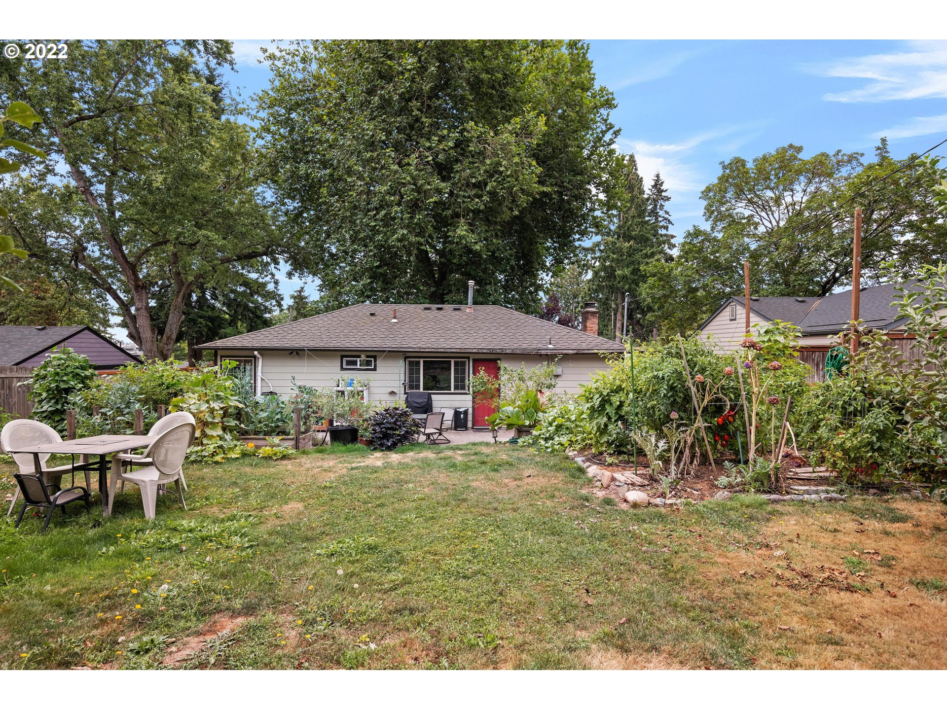 12855 Southwest Douglas Street Portland, OR 97225 - Photo 28 of 32 a view of a table and chairs under an umbrella