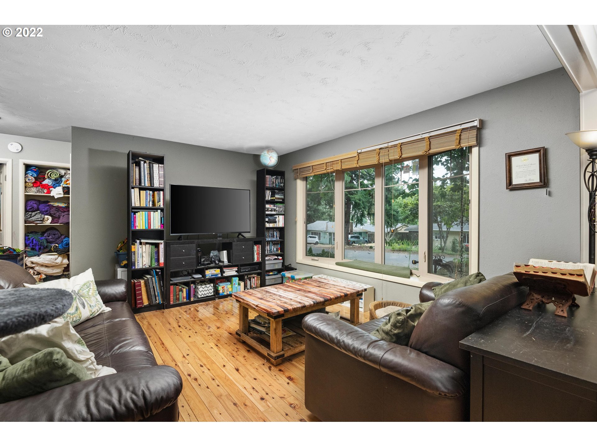 12855 Southwest Douglas Street Portland, OR 97225 - Photo 3 of 32 a living room with furniture and a flat screen tv