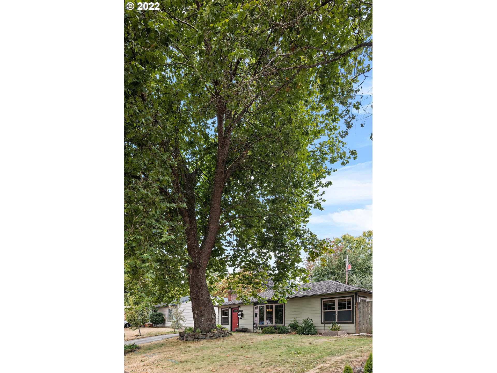 12855 Southwest Douglas Street Portland, OR 97225 - Photo 32 of 32 a view of a house with a tree