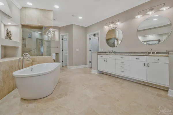 a bathroom with a bathtub and shower