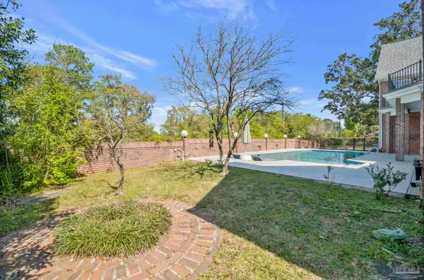 a view of backyard with green space