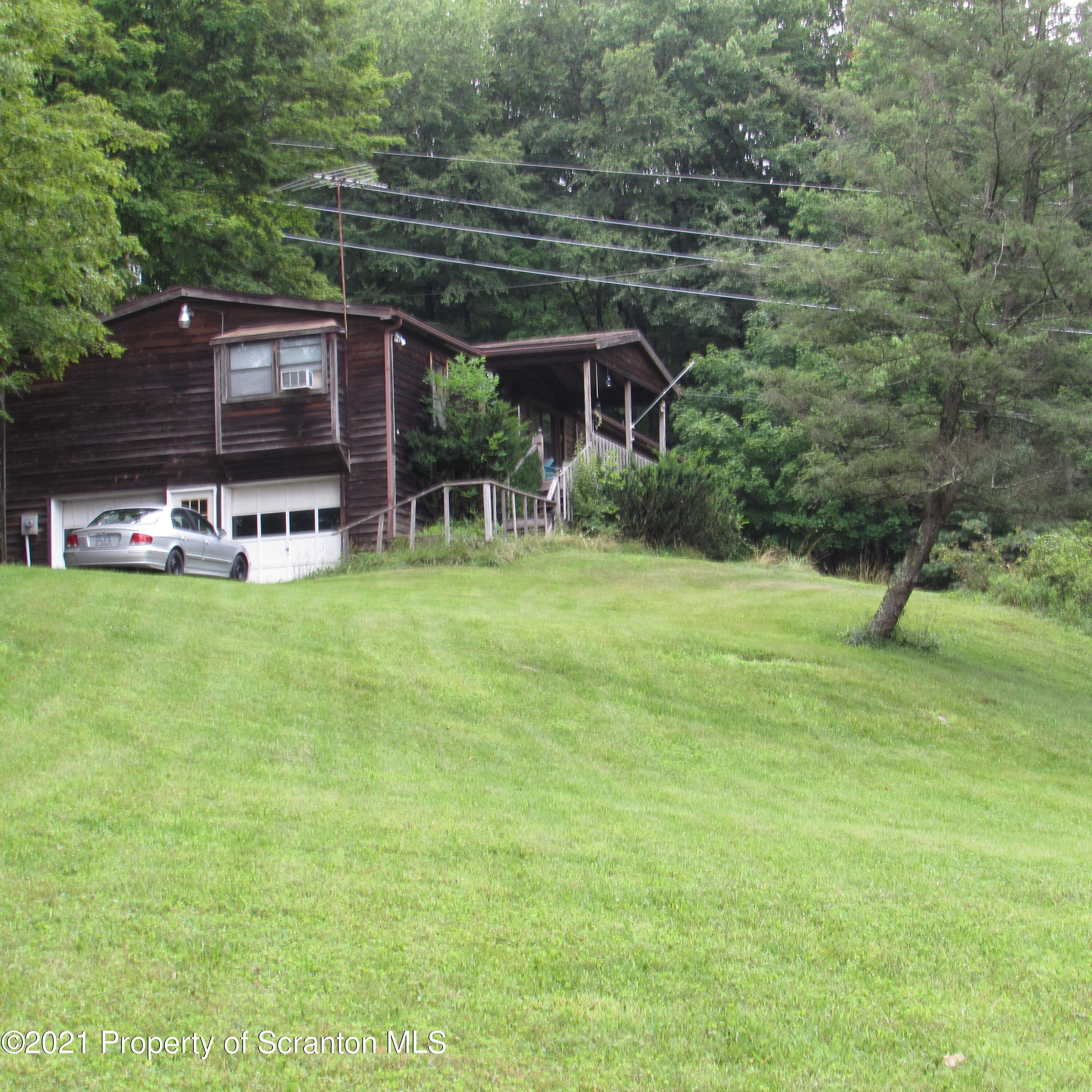 7211 State Rte 3001 Meshoppen, PA 18630 - Photo 6 of 23 a backyard of a house with yard and staircase