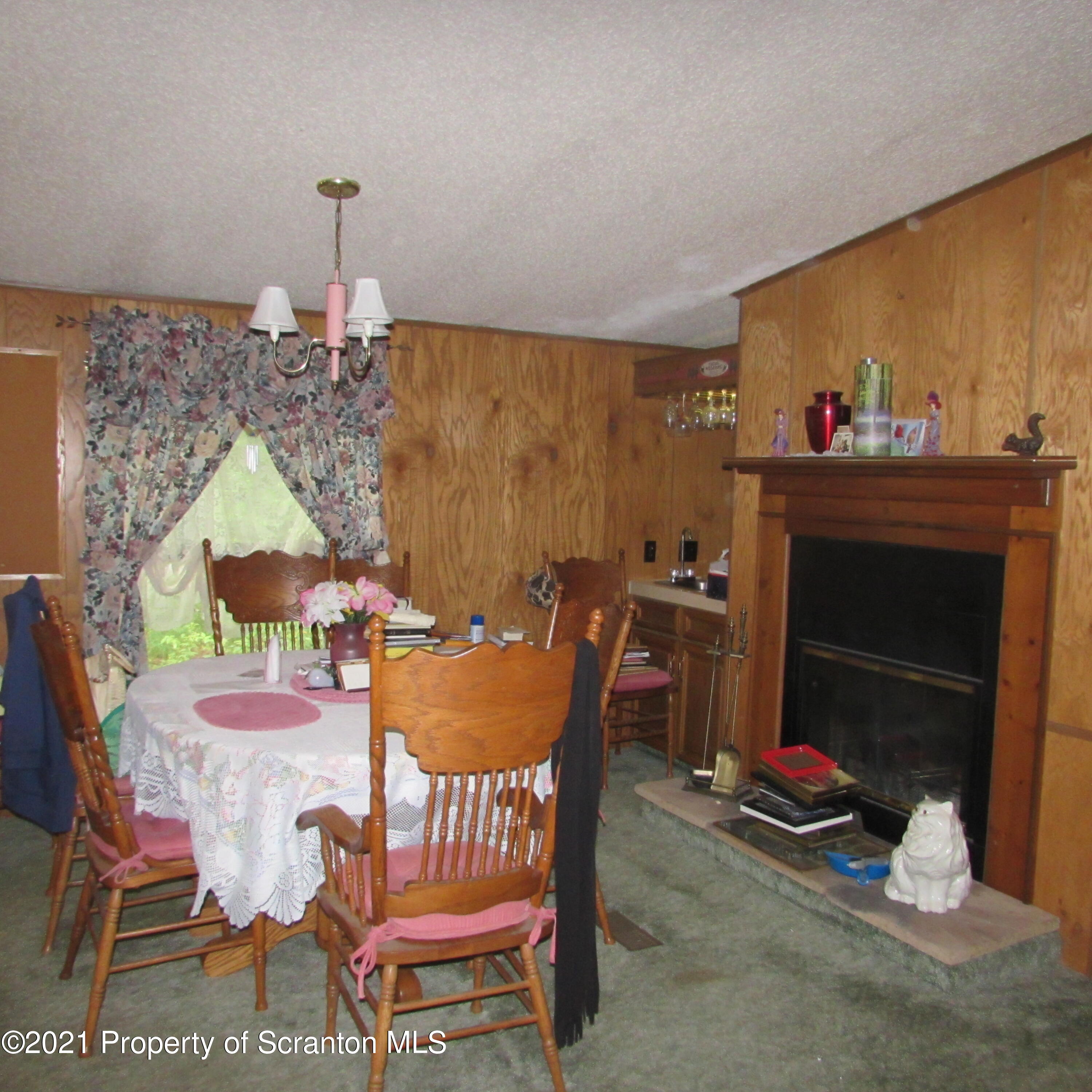 7211 State Rte 3001 Meshoppen, PA 18630 - Photo 8 of 23 a dining room with furniture and a fireplace