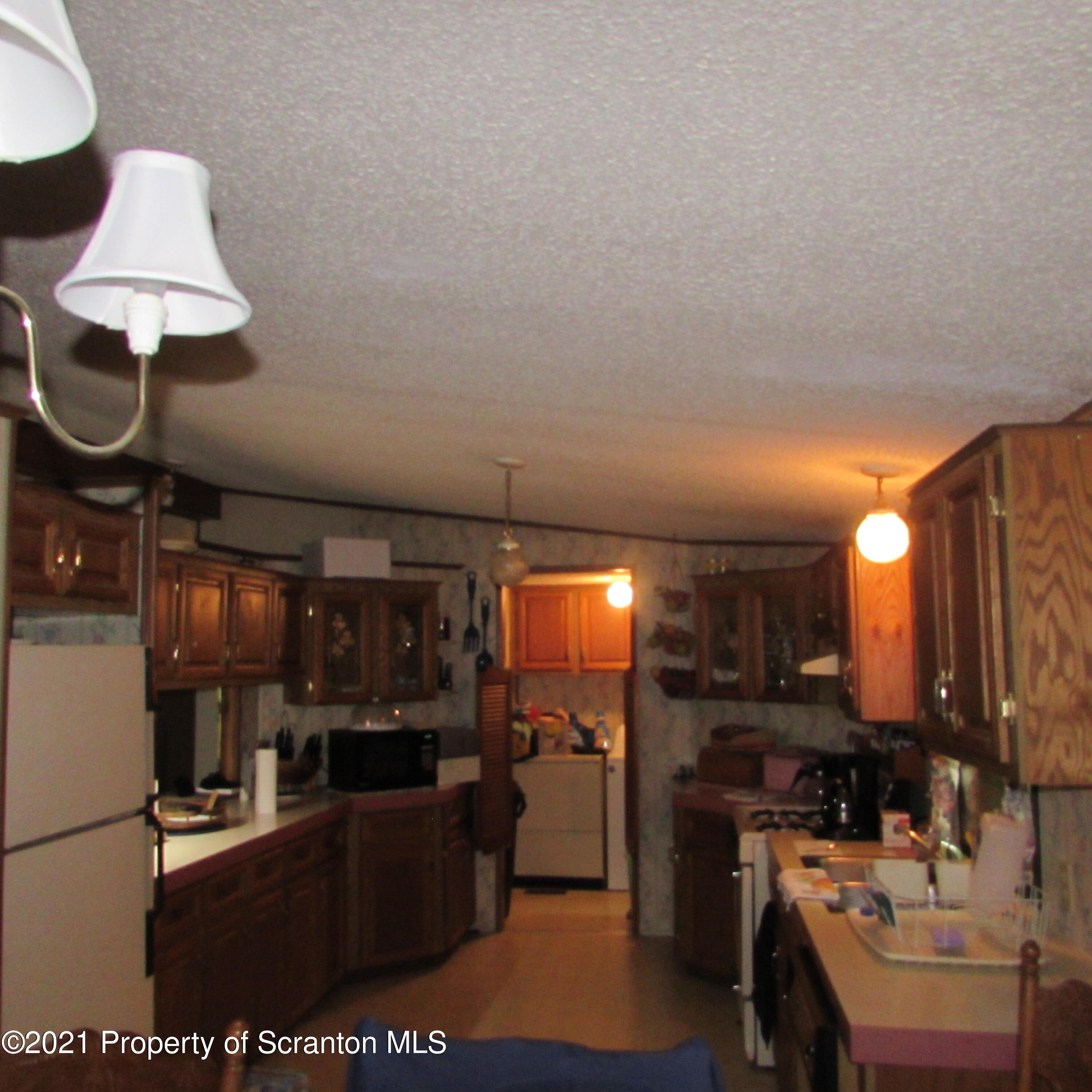 7211 State Rte 3001 Meshoppen, PA 18630 - Photo 9 of 23 a kitchen with stainless steel appliances granite countertop a sink a stove and a refrigerator