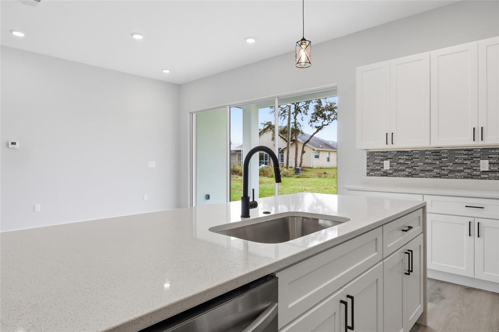 13975 Southwest 27 Ct Road Ocala, FL 34473 - Photo 16 of 35 a kitchen with a sink and cabinets