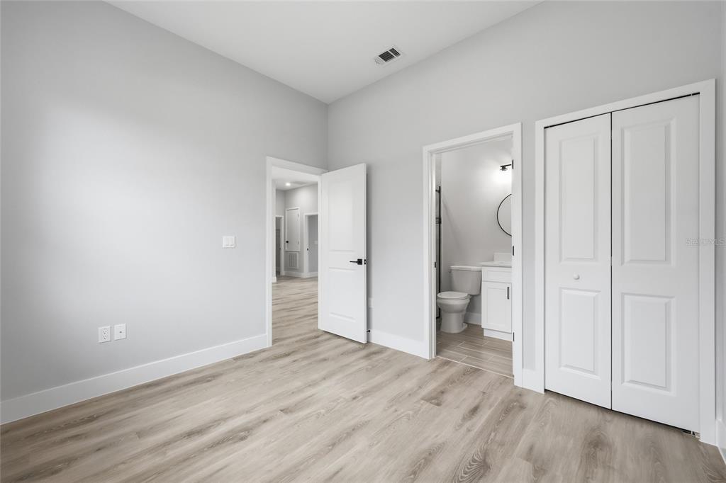 13975 Southwest 27 Ct Road Ocala, FL 34473 - Photo 23 of 35 a view of a bathroom with toilet shower and wooden floor