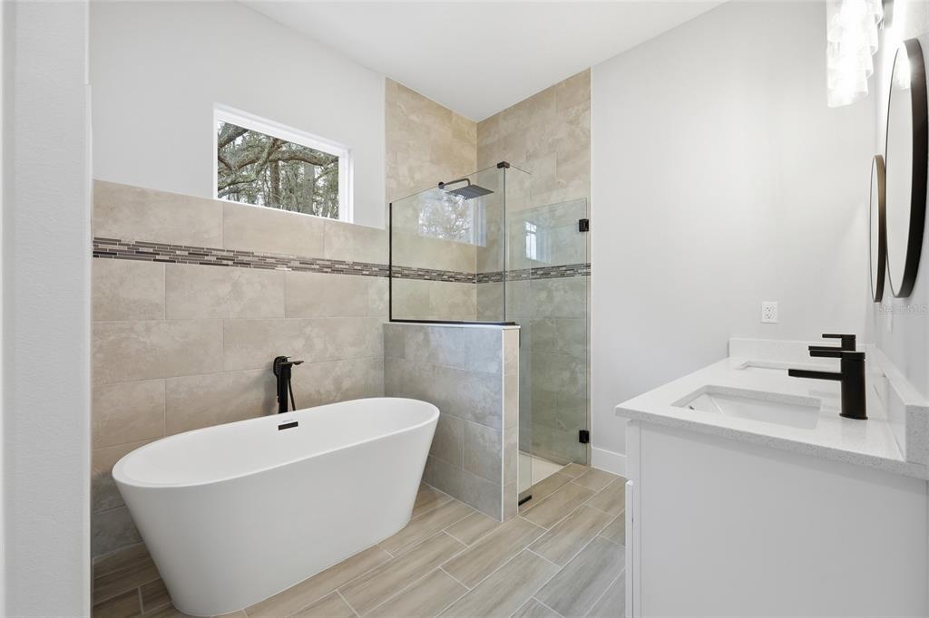 13975 Southwest 27 Ct Road Ocala, FL 34473 - Photo 29 of 35 a bathroom with a sink and a mirror