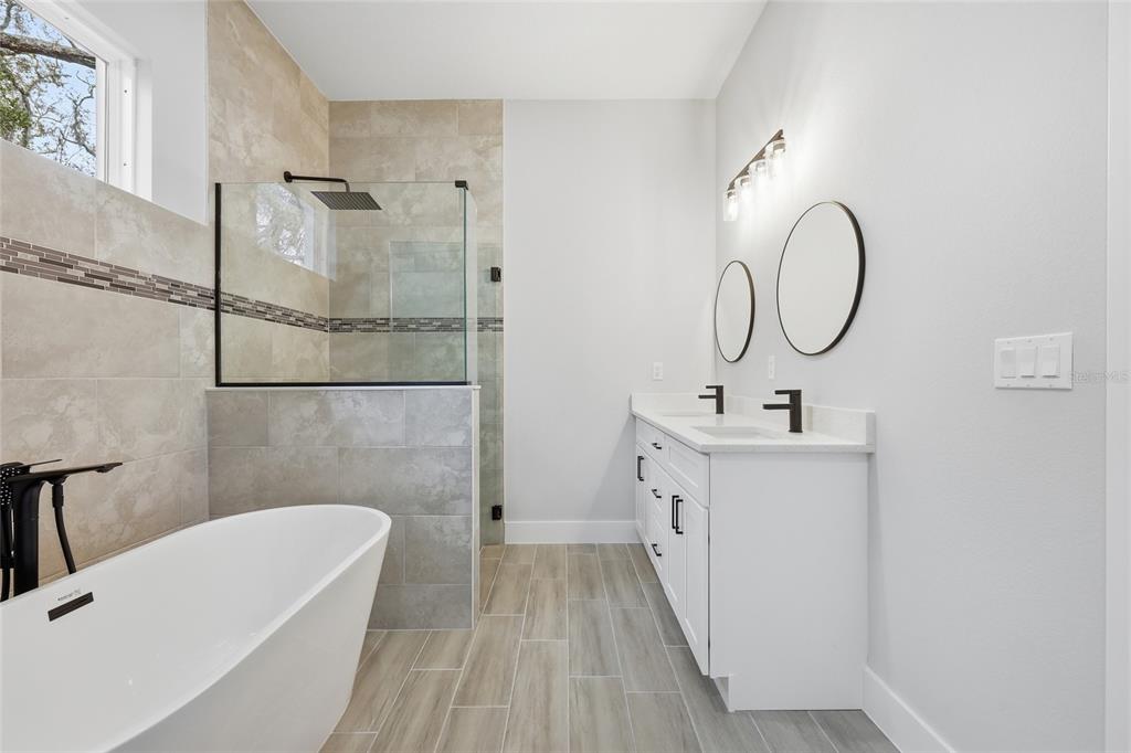 13975 Southwest 27 Ct Road Ocala, FL 34473 - Photo 31 of 35 a bathroom with a sink a toilet and a bathtub
