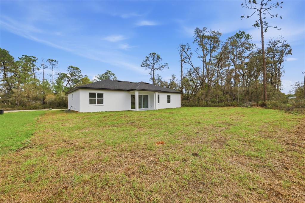 13975 Southwest 27 Ct Road Ocala, FL 34473 - Photo 33 of 35 a front view of a house with a yard