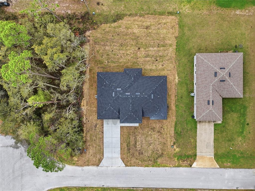 13975 Southwest 27 Ct Road Ocala, FL 34473 - Photo 4 of 35 an aerial view of houses with a yard