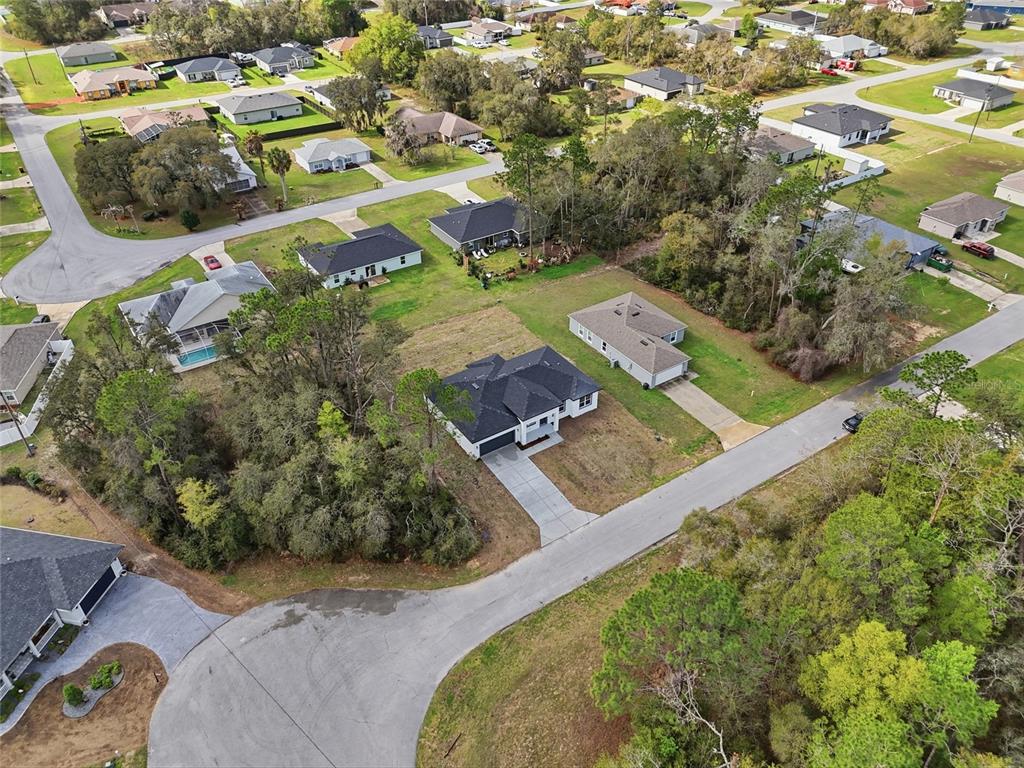 13975 Southwest 27 Ct Road Ocala, FL 34473 - Photo 5 of 35 an aerial view of residential houses with outdoor space