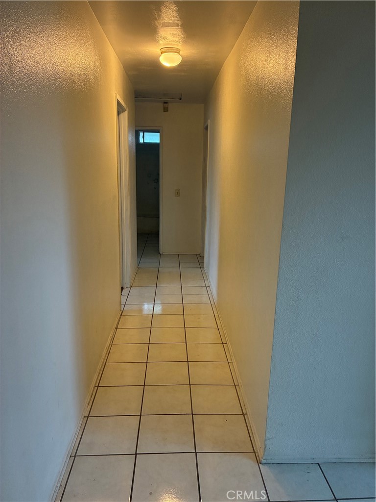 1144 North Glenwood Avenue Rialto, CA 92376 - Photo 22 of 35 a view of hallway with a bathroom