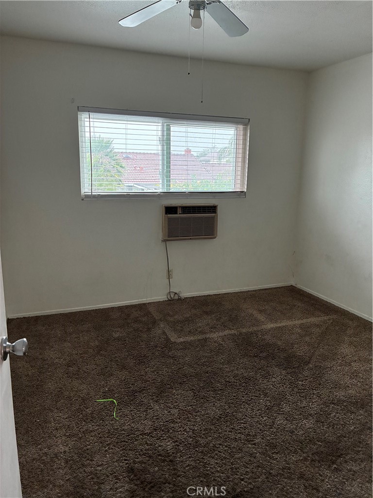 1144 North Glenwood Avenue Rialto, CA 92376 - Photo 25 of 35 a view of an empty room with a window