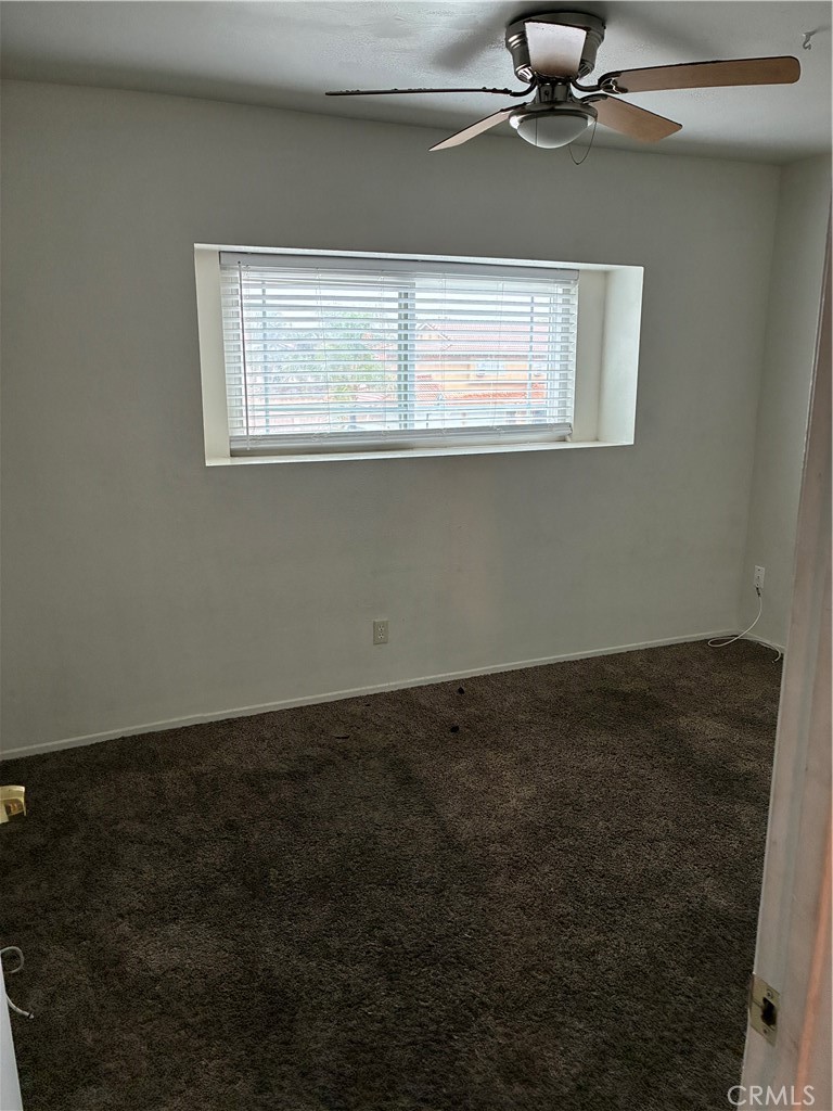 1144 North Glenwood Avenue Rialto, CA 92376 - Photo 26 of 35 a view of an empty room with a window