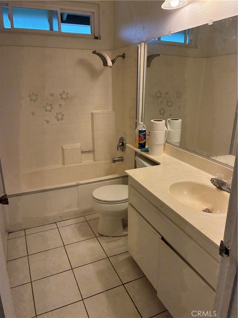 1144 North Glenwood Avenue Rialto, CA 92376 - Photo 27 of 35 a bathroom with a sink a toilet and shower