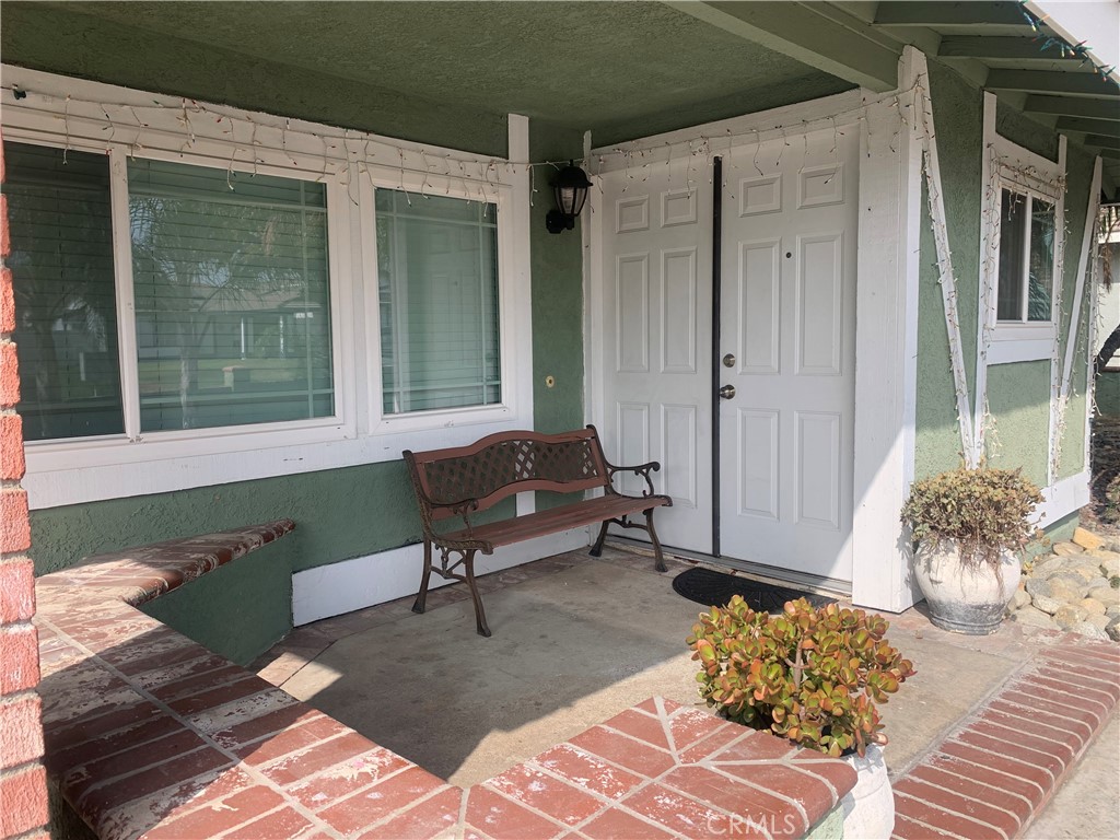 1144 North Glenwood Avenue Rialto, CA 92376 - Photo 5 of 35 a balcony with furniture and a potted plant