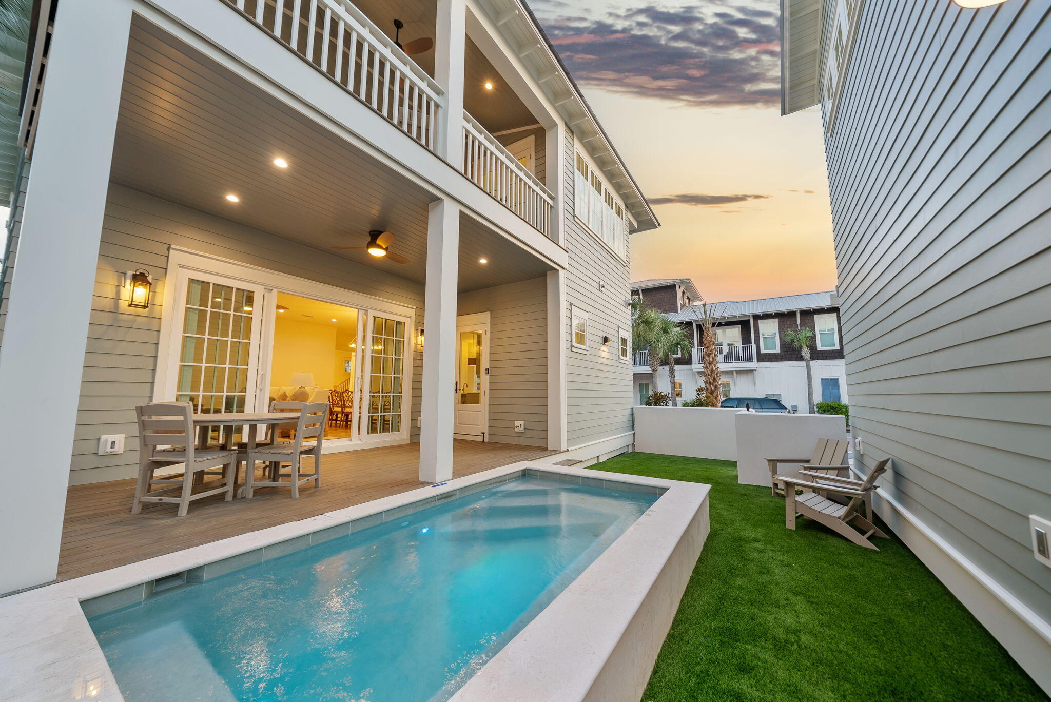 272 Beach Bike Way Inlet Beach Inlet Beach, FL 32461 - Photo 2 of 61 a swimming pool with outdoor seating and a garden
