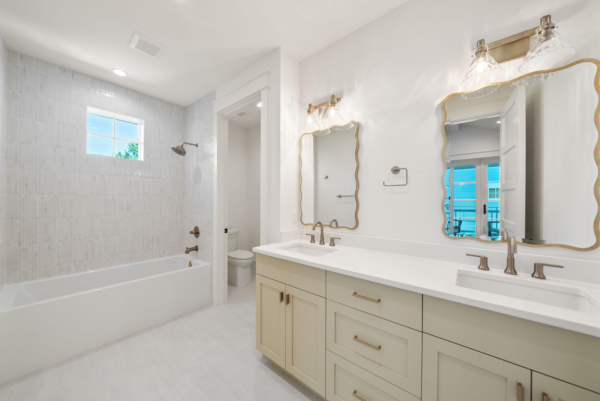 272 Beach Bike Way Inlet Beach Inlet Beach, FL 32461 - Photo 32 of 61 a spacious bathroom with a double vanity sink a mirror a bathtub and next to a window