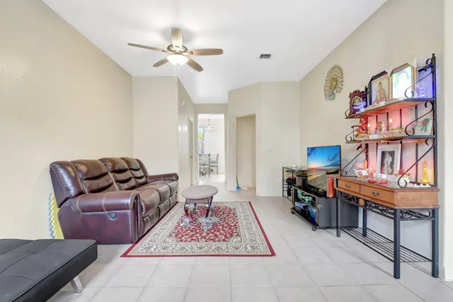 a living room with furniture and a rug