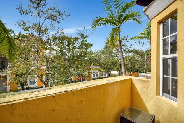 a view of a swimming pool with a yard