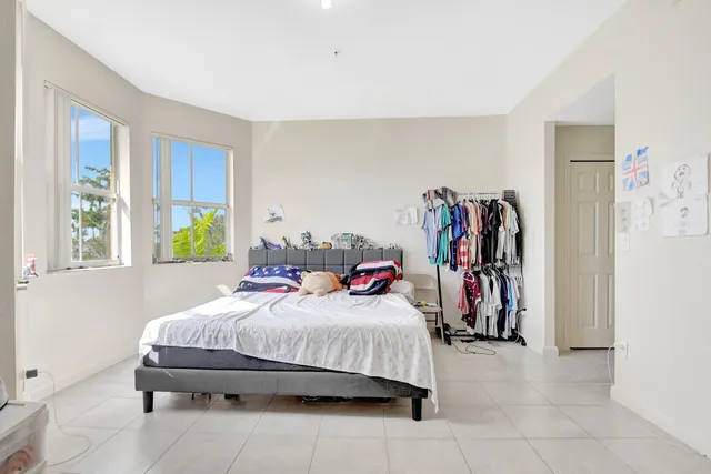 a bedroom with a bed and a walk in closet