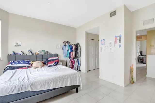 a bathroom with a sink double vanity and a toilet