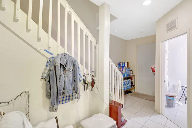 a living room with lots of furniture and white walls