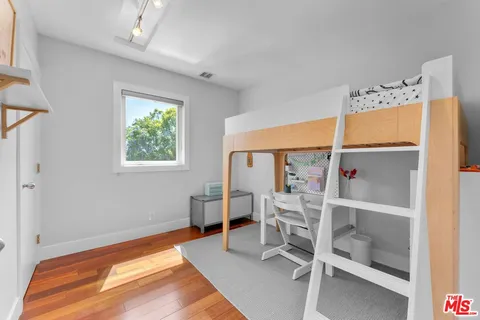 a view of a livingroom with furniture and staircase