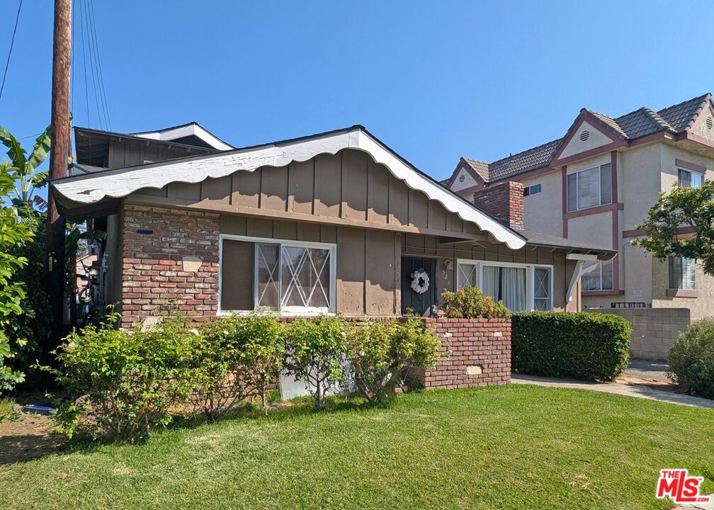 525 Howard Street Alhambra, CA 91801 - Photo 2 of 6 a front view of a house with a yard and potted plants