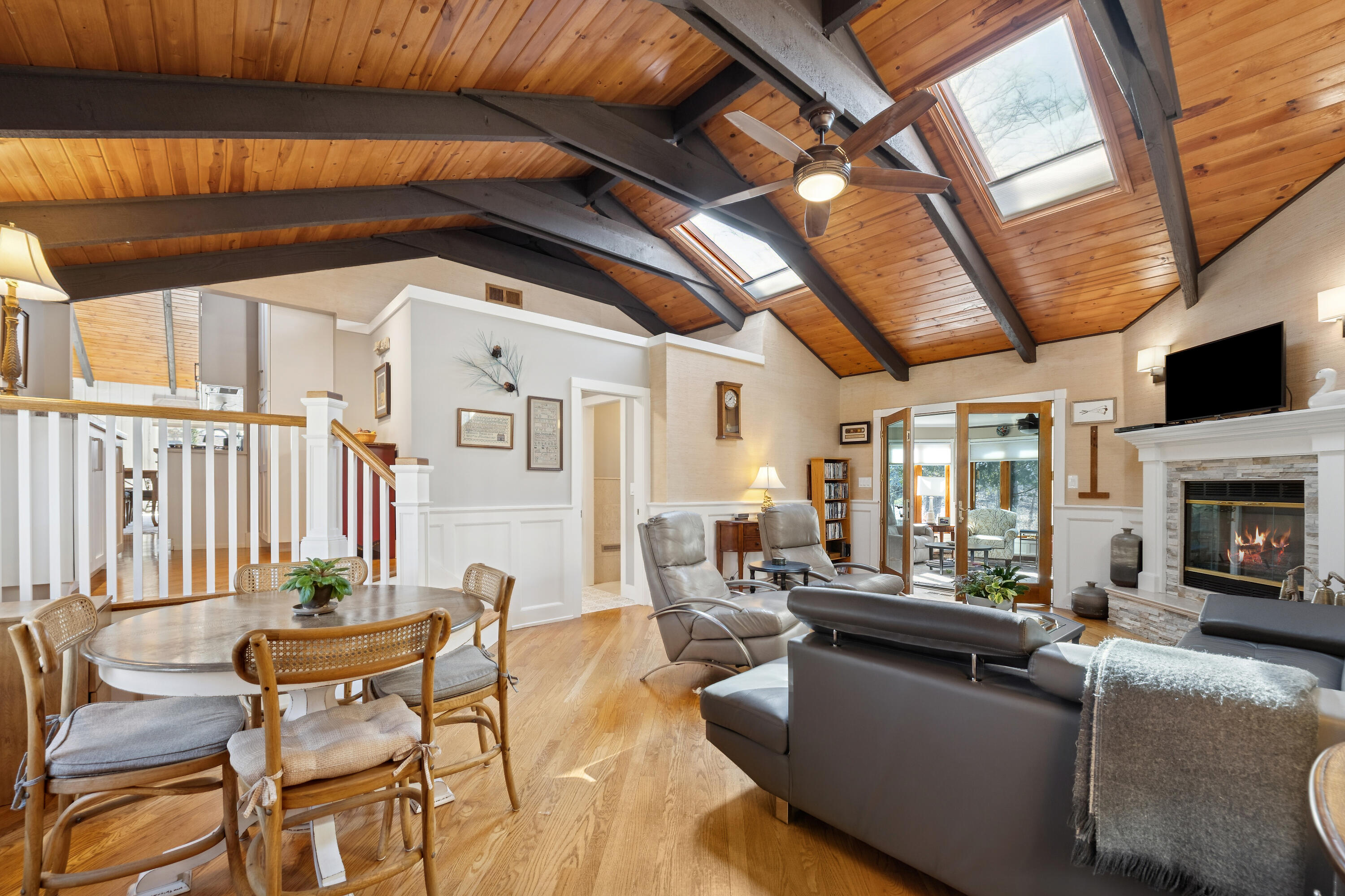 N2337 West Main Road Linn, WI 53147 - Photo 3 of 26 Living Room w/vaulted beamed ceiling and fireplace
