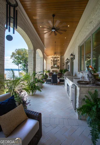 a building outdoor space with patio furniture and potted plants