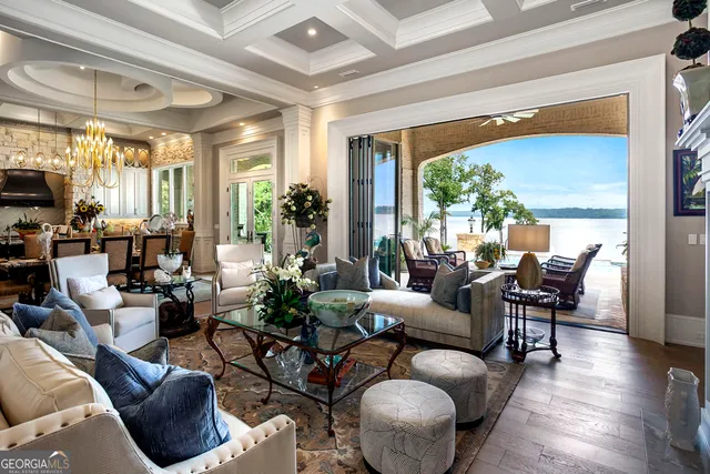 a view of staircase with wooden floor and a chandelier